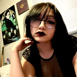 Livz, Onlyfans Model with Dark Hair, Leather Outfit and Eye Makeup