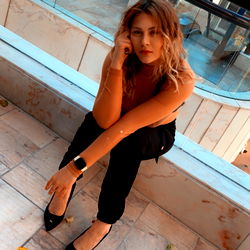 Model AngelBaby in Stylish Pose at Restaurant Entrance