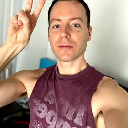 Fitness Enthusiast Thomas Posing in Gym