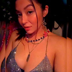 Stylish OnlyFans Model in Sequined Dress Posing for Camera