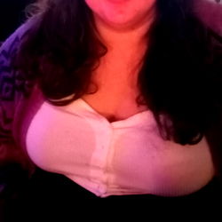 A woman sitting at a table in a restaurant,