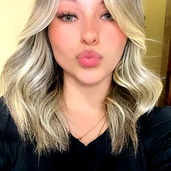 Isabella, a Blonde Beauty with Long Hair and Shiny Eyes