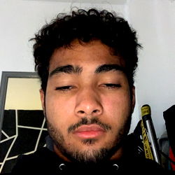 Athletic Individual with Black Hair, Displaying Serious Expression