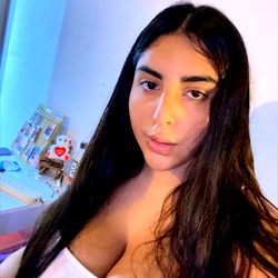 Sara, a young adult model posing confidently in front of mirror