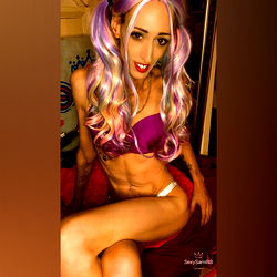 Vivid Vixen in Vibrant Costume