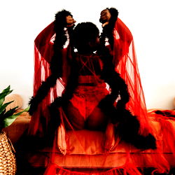 Vibrant OnlyFans Model with Red Dress and Veil