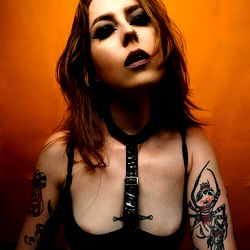 Sadie Sloane, OnlyFans Model with Tattoos and Piercings in Busty Photoshoot