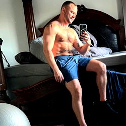 Fit and Muscular Man in Blue Shorts, Arizona Style