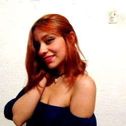 Gingerfx, A Young Female Model Smiling at the Camera