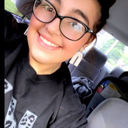 Emilee Hatfield - Cheerful Driver with Black Shirt and Glasses
