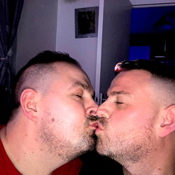 Intimate Moment Between Two Men in a Home