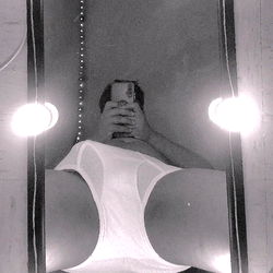 An OnlyFans Model's Reflection in a Mirror