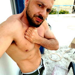 Athens-Based Model TopGun XL Poses in Athletic Outfit