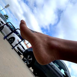 Close-up of a SoleSisters model's foot on a car, featuring a pedicure and natural nails. The image is from OnlyFans and is part of the SoleSisters collection.