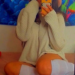 Young Female Model Lil_mimi Taking a Selfie in a Cozy Sweater and Leggings