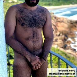 Brazilian Lumberjack Poses Shirtless, Showcasing His Chest and Beard