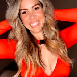 Nicole Alexander in a Red Bodysuit
