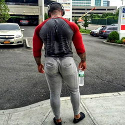 Strong and Muscular Man Walking in City