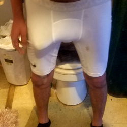 OnlyFans Model AndyK in White Shirt and Boxers with Phone