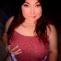 Mara, an OnlyFans Model in a Red Top