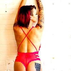 Magenta, a lingerie model showcasing her outfit