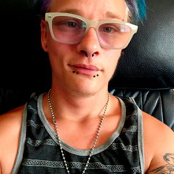 Young Adult Male with Purple Hair and Glasses