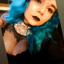 Vibrant Blue Haired OnlyFans Model in Fishnet