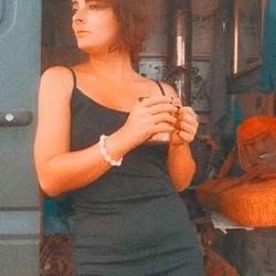 Stylish Model Posing Against Backdrop