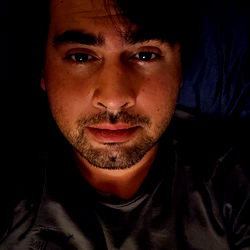 Chris, a young man posing for the camera