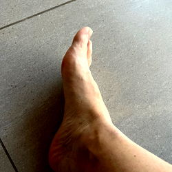 Alessandro's Feet on Tile Floor