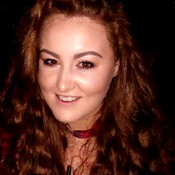 Young Woman with Red Hair and Smile