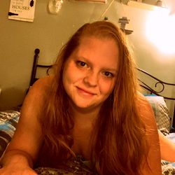 Young Woman Relaxing on Bed