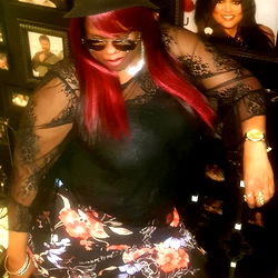 Mizz Thyck in Vibrant Floral Top and Sunglasses