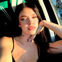 Rossa Vaxx, model, in car selfie