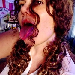 An adult woman making a playful face