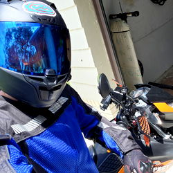 Adonis B., Florida Rider in Blue Jacket and Helmet Preparing Ride