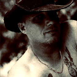 Tattooed Man in Cowboy Hat