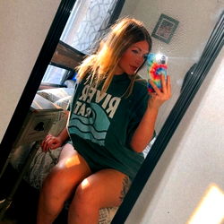 Model Savy in a Bathroom Mirror