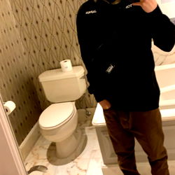 A Model Selfie in a Restroom