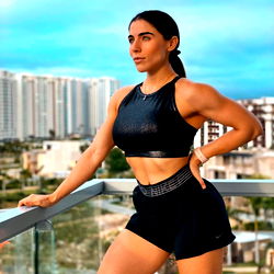 Fitness Model Posing in a Tank Top and Shorts