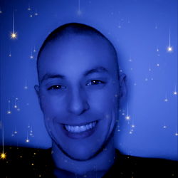Smiling Male with Short Hair, Blue Background, Stars, and Smile