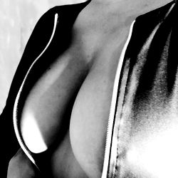 OnlyFans Model in Zippered Jacket Showcasing Cleavage
