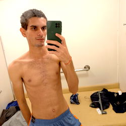 Rhuan Gomez Sharing a Mirror Selfie in a Bathroom