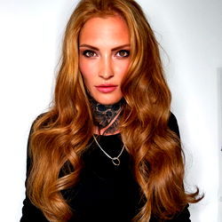 Auburn-haired model with a neutral expression