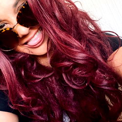 MARIA JADE, a vibrant model with striking red hair and a playful spirit, shares her day in Central Florida. Her lively energy is evident as she poses for this candid shot!