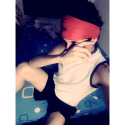 A person taking a selfie in their bedroom