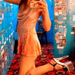 Marcy in a disco outfit, striking a pose