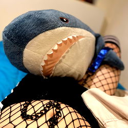 Emily in a Stylish Pose with a Fish Plushie and Netting