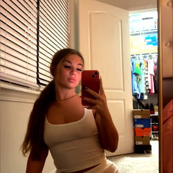 OnlyFans Model Jordan Alexis in a White Tank Top Posing for the Camera