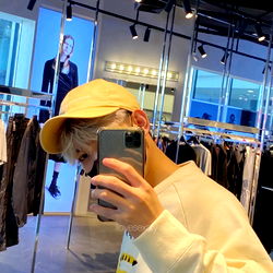 Model in Department Store Taking a Selfie